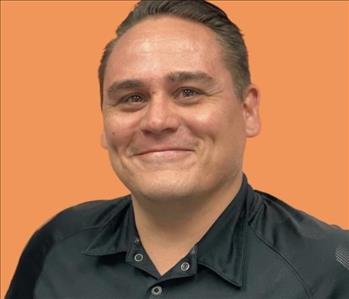 man in front of orange background