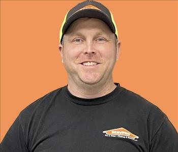 man in front of orange background