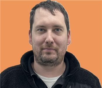 man in front of orange background