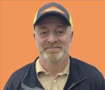 man in front of orange background